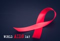 Red ribbon awareness on black background for World Aids day