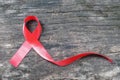 Red ribbon awareness for World aids day campaign supporting patient`s with HIV virus, sexually transmitted disease STD