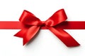 Red ribbon bow on card note white background wrapping. Copy text space Royalty Free Stock Photo