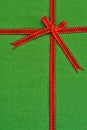 Red ribbon and bow over green Royalty Free Stock Photo