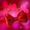 Red ribbon with bow on a white background.