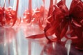 red ribbon bows on a frosted glass surface Royalty Free Stock Photo