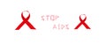 Red Ribbon clothes with text stop aids on white background, World Aids Day concept, December 1st, international campaign.