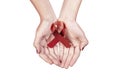 Red ribbon Hiv Aids on woman hands Royalty Free Stock Photo