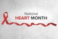 Red Ribbon, National Heart Month Awareness with Copy Space