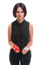 A girl holding a condom and a red ribbon isolated on a white background. Medical support. Safe sex propaganda concept. Royalty Free Stock Photo