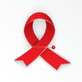 Red ribbon pinned to the collar of medical robe. Stop AIDS. The concept of the poster or web banner.