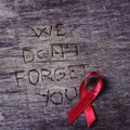 Red ribbon and text we do not forget you