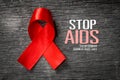 Red ribbon with text world aids day awareness campaign