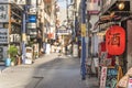 Red rice paper lantern with japanese kanji sake which mean Alcool on the front of an restaurant in the shopping street from the Royalty Free Stock Photo