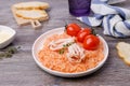 Red rice with seafood tentacles and tomatoes