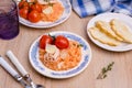 Red rice with seafood tentacles and tomatoes