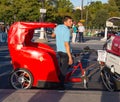 Red rickshaw for tourists with Ferrari car logo near Eiffel Tower in Paris, France Royalty Free Stock Photo