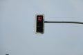 a red right turn traffic light hanging on metal post Royalty Free Stock Photo