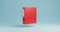 Red ring binder floating against a light blue background Royalty Free Stock Photo