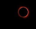 A fiery red ring surrounds the moon during totality of eclipse