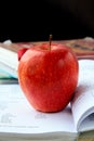 Red ripe apple with English textbooks Royalty Free Stock Photo