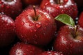 red ripe apples, adorned with glistening water droplets that add a touch of freshness to the fruity background