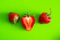 Red ripe berry of strawberry on green Matt background Royalty Free Stock Photo