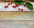 Red ripe cherries on a background of old barn boards Royalty Free Stock Photo
