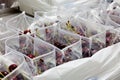 Red ripe cherries being bagged for shipment in a fruit packaging warehouse to market Royalty Free Stock Photo