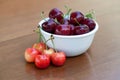 Red ripe cherries and rainier cherries on table