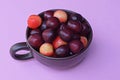 red ripe cherries in a brown ceramic cup Royalty Free Stock Photo