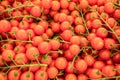Red ripe cherry tomatoes closeup on the farm market stall. Food background Royalty Free Stock Photo