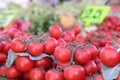 Red ripe cherry tomatoes on green branch at market Royalty Free Stock Photo