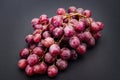 Red ripe grape over grey Royalty Free Stock Photo