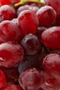 Red ripe grape with water drops all over background Royalty Free Stock Photo