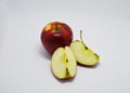 Red, ripe, juicy apples on a white background. one whole and two slices Royalty Free Stock Photo