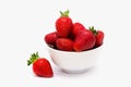 Red ripe large strawberries in a white cup or bowl on a white background Royalty Free Stock Photo