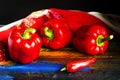 Red ripe peppers lying on a bright colored background. Royalty Free Stock Photo