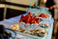 Red,ripe strawberries in a glass bowl on white table Royalty Free Stock Photo