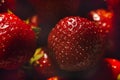 Red, ripe strawberries with well-defined texture in close-up. Macro shot of a strawberry. Background, screensaver