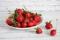 Red and ripe strawberry berry on a white background. Royalty Free Stock Photo