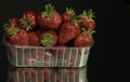 Red ripe strawberry in plastic box of packaging on table Royalty Free Stock Photo