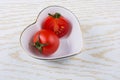 Red ripe tasty fresh cherry tomatos cut in half Royalty Free Stock Photo
