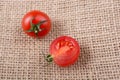 Red ripe tasty fresh cherry tomatos cut in half Royalty Free Stock Photo