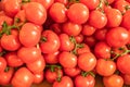 Red ripe tomatoes closeup on the farm market stall. Food background