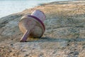 Red river buoy lies on the shore due to shallowing of the river Royalty Free Stock Photo