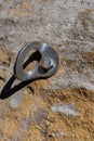 Red river gorge rock climbing bolt casting shadow on sandstone rock face Royalty Free Stock Photo