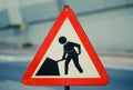 Red road work sign