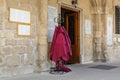 Red robes for women at the main gate of Orthodox Church of Saint Lazarus in Larnaca Larnaka Cyprus