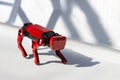 Red robot dog, suitable for industrial detection and remote operation white shadows background Royalty Free Stock Photo