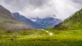 Red Rock Canyon Parkway leading to the Red Rock Canyon in Waterton Lakes National Park Royalty Free Stock Photo