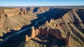Red Rock Canyon with a Winding River Below and Dramatic Layered Cliffs Under a Clear Blue Sky Keywords: canyon, red rock, Royalty Free Stock Photo