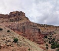 Red rock desert, cliff, cloudy. Royalty Free Stock Photo