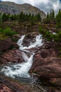 Red Rock Falls at Many Glacier, Glacier National Park Royalty Free Stock Photo